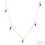 5x3 MM Oval Shape Emerald and 1/8 Ctw Round Cut Diamonds Precious Station Necklace in 10K Yellow Gold