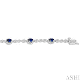 5x3 MM Oval Cut Sapphire and 1/20 Ctw Single Cut Diamond Bracelet in 10K White Gold