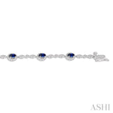 5x3 MM Oval Cut Sapphire and 1/20 Ctw Single Cut Diamond Bracelet in 14K White Gold