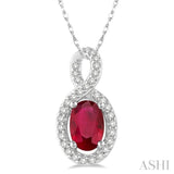 6x4 MM Oval Cut Ruby and 1/10 ctw Round Cut Diamond Pendant in 10K White Gold with Chain