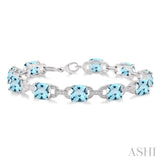 7x7  MM Cushion Shape Blue Topaz and 1/20 ctw Round Cut Diamond Fashion Bracelet in Sterling Silver