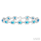 1/10 ctw Round Cut Diamond & 6x4 MM Oval Cut Blue Topaz Semi Precious Bracelet in Sterling Silver
