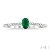 5x3 MM Oval Cut Emerald and 1/10 Ctw Petite Round Cut Diamond Precious Fashion Ring in 10K White Gold